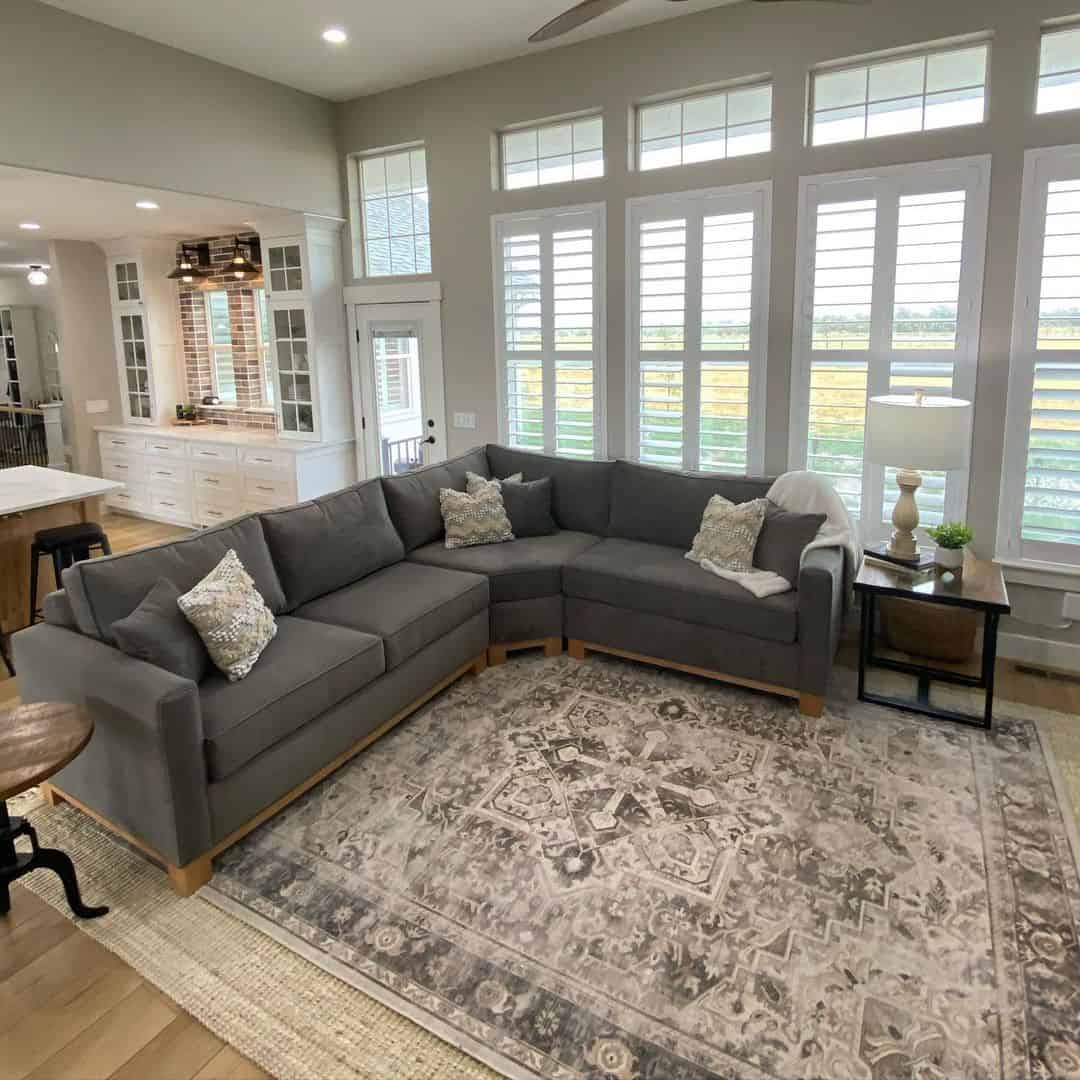 Soften a Dark Sectional with Wood Trim