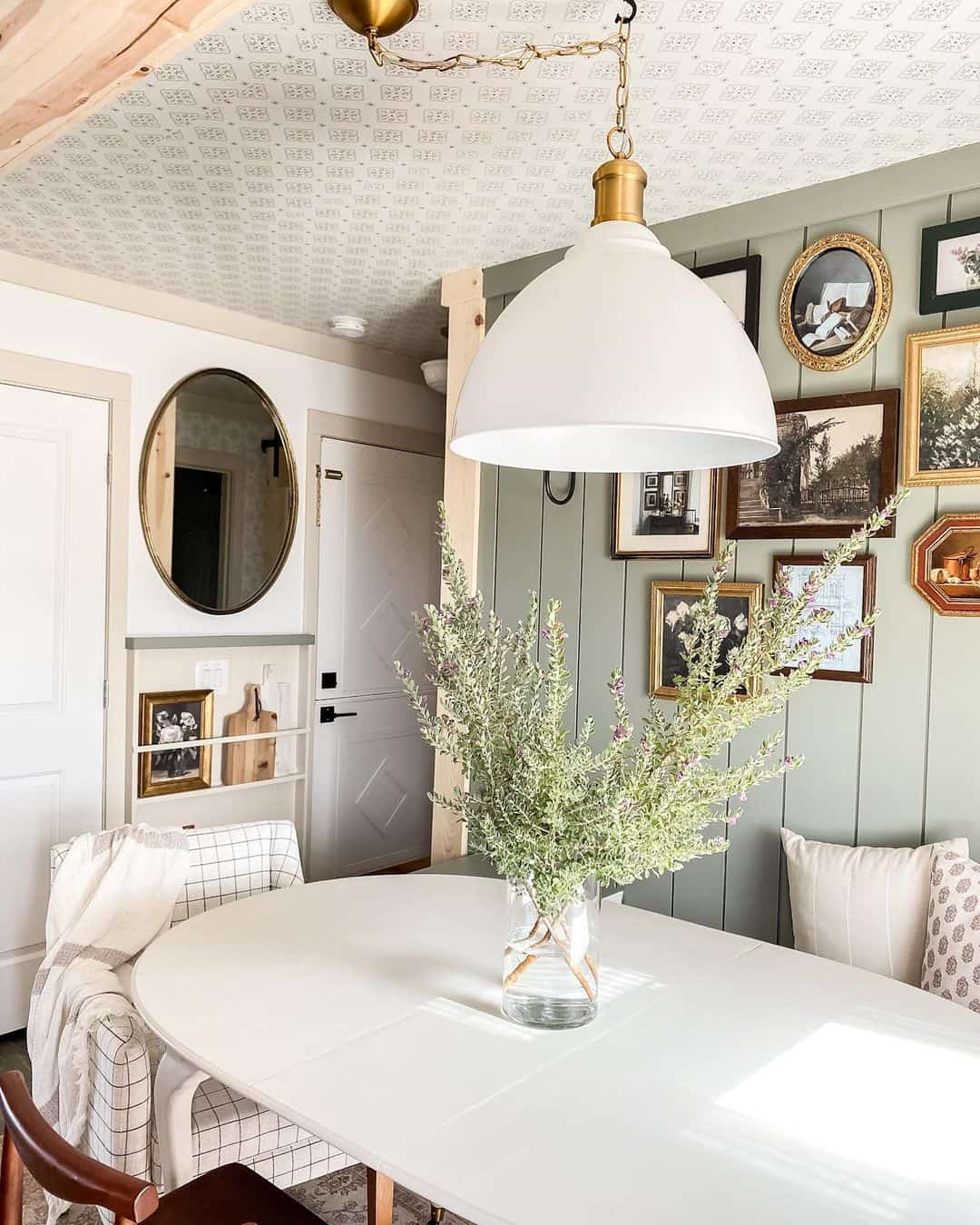 Gallery Wall of Vintage Art Adds Character Above Paneling
