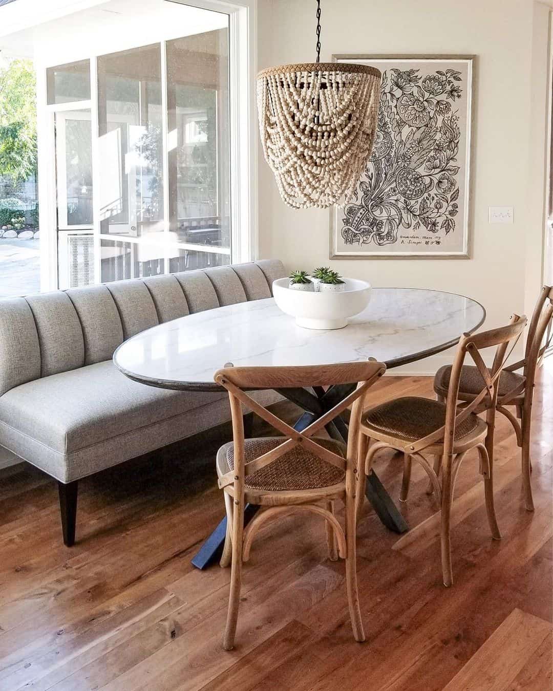 Oval Marble Table With X-Base Anchors Your Nook