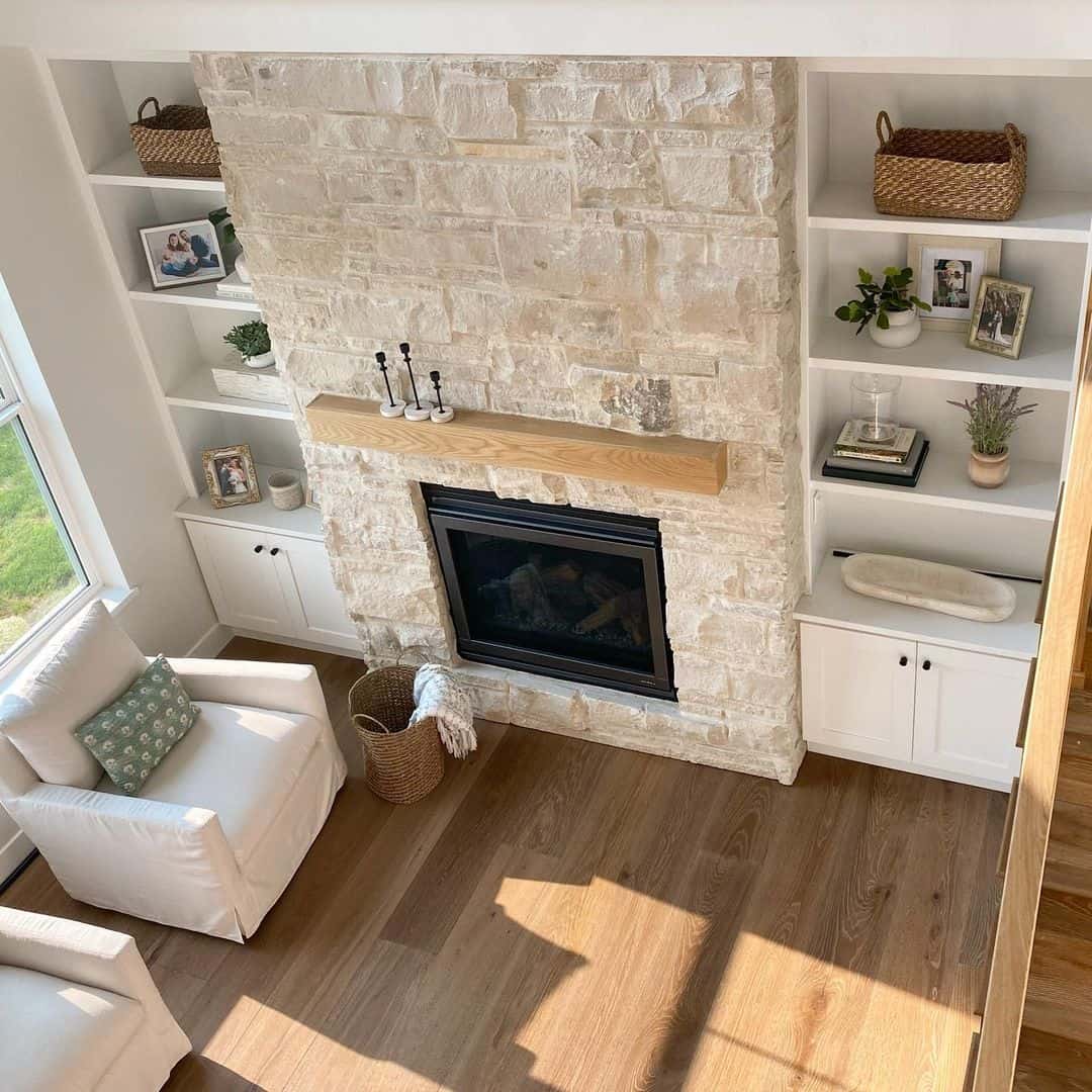 Natural Wood Mantel Adds Warmth to a Textured Stone Fireplace