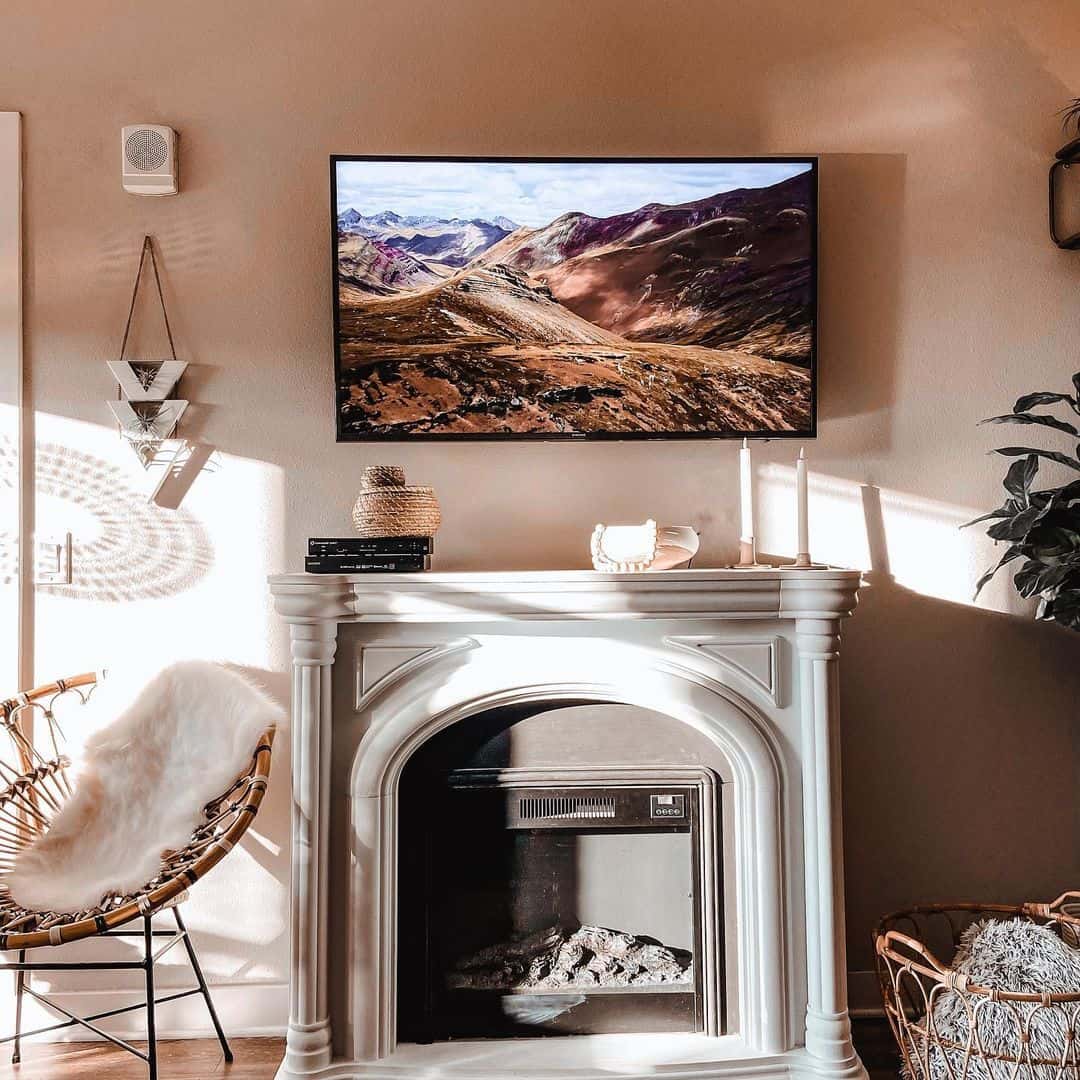 White Mantel Frames Fireplace with Subtle Texture and Natural Accents