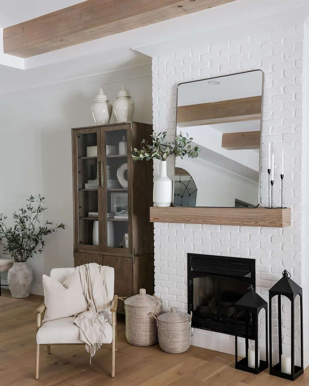 Rounded Rectangular Mirror Adds a Soft Geometric Focal Point Above the Mantel