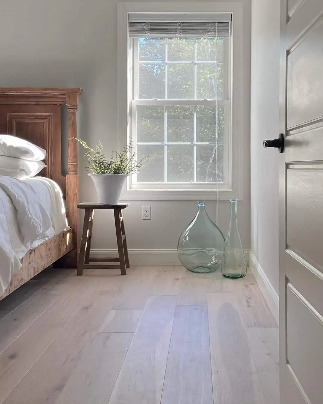 Oversized Glass Demijohns Add Sculptural Interest to Floor Space