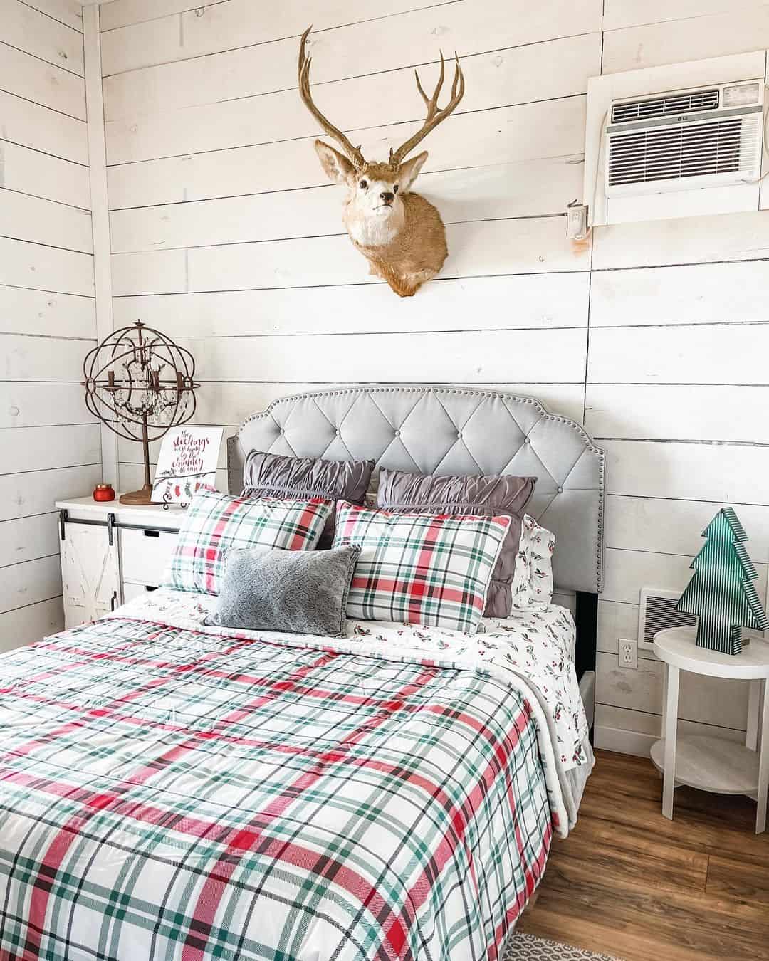 Rustic Deer Mount Adds Natural Focal Point Above Tufted Headboard