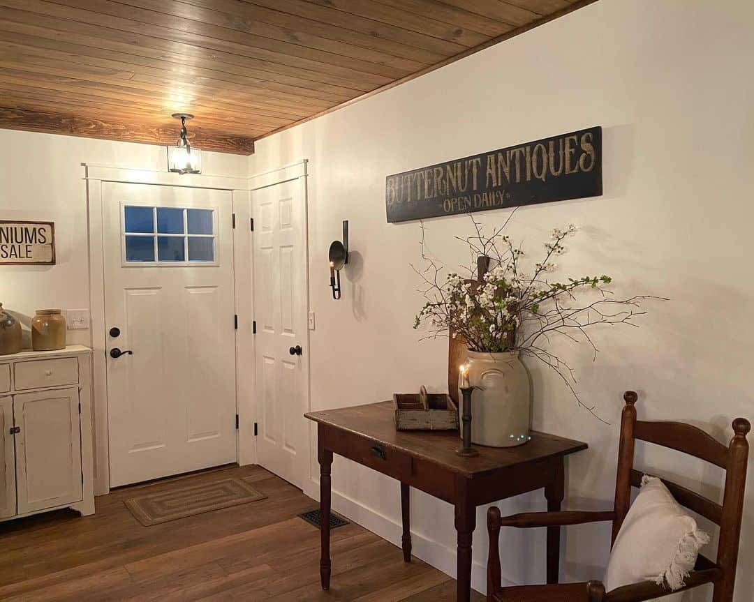 Oversized Crock Holds Branches and Blossoms for Rustic Entryway