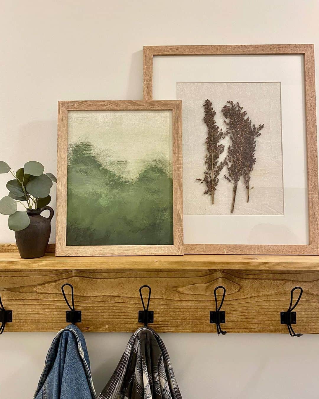 Layer Artwork for Depth Above a Coat Rack