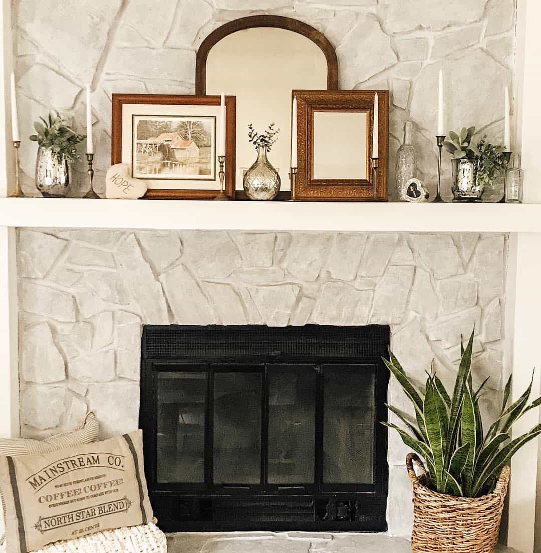 Layer Your Mantel Display Behind an Arched Mirror