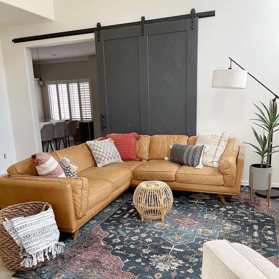 Chevron Barn Doors Add a Dramatic Backdrop to Leather Seating