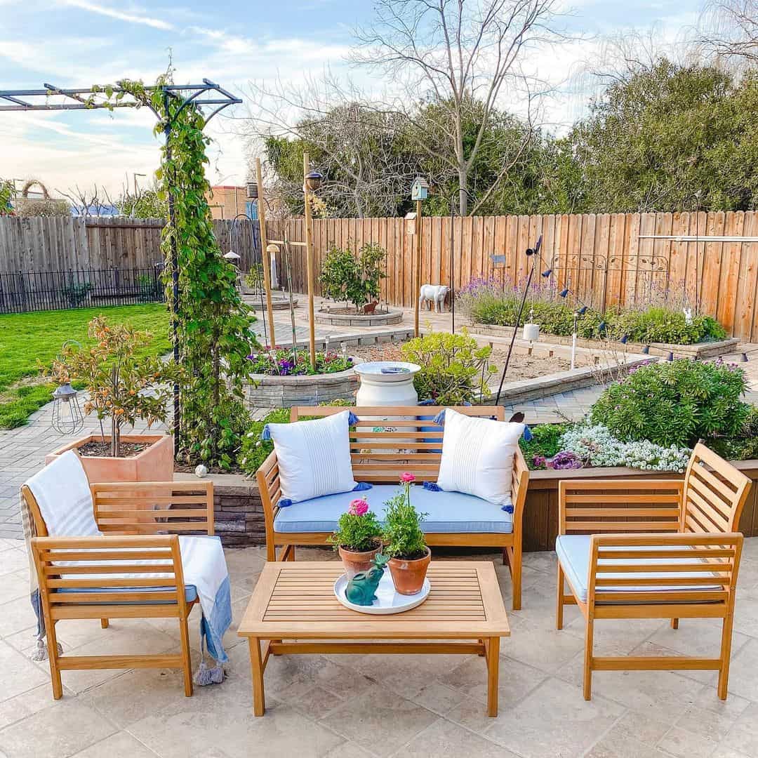 Style a Wooden Patio Set with Blue Cushions and Tassel Accents