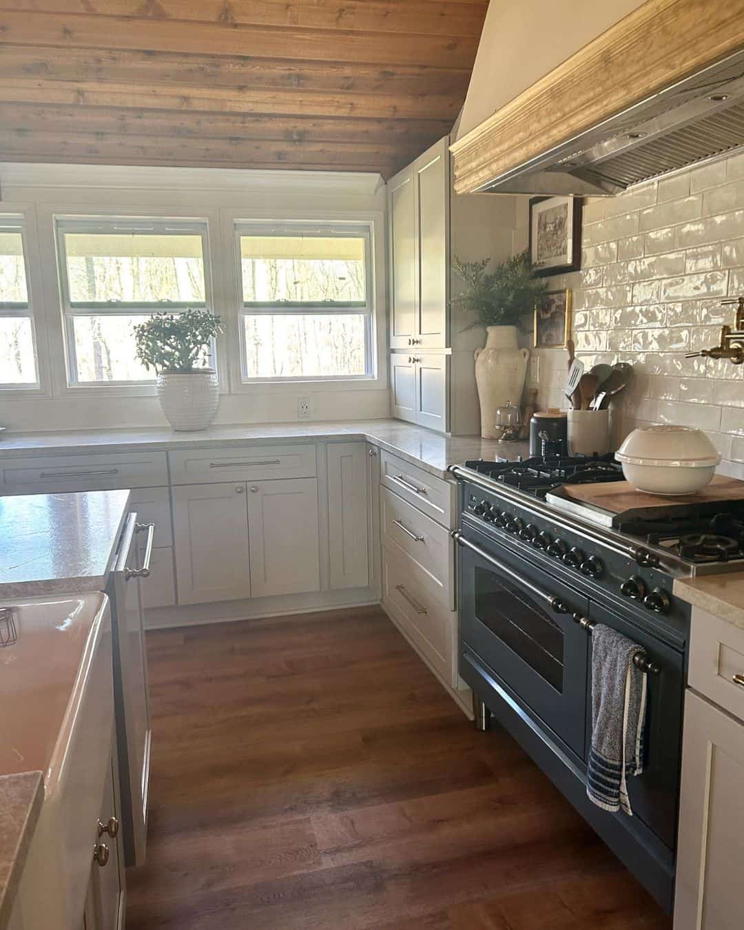 Wood Plank Ceiling Adds Cabin Charm Above Light Cabinets