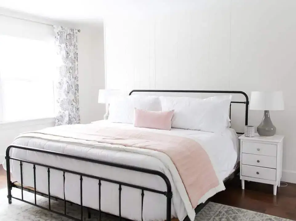 Contrast Soft Bedding with a Black Metal Bed Frame