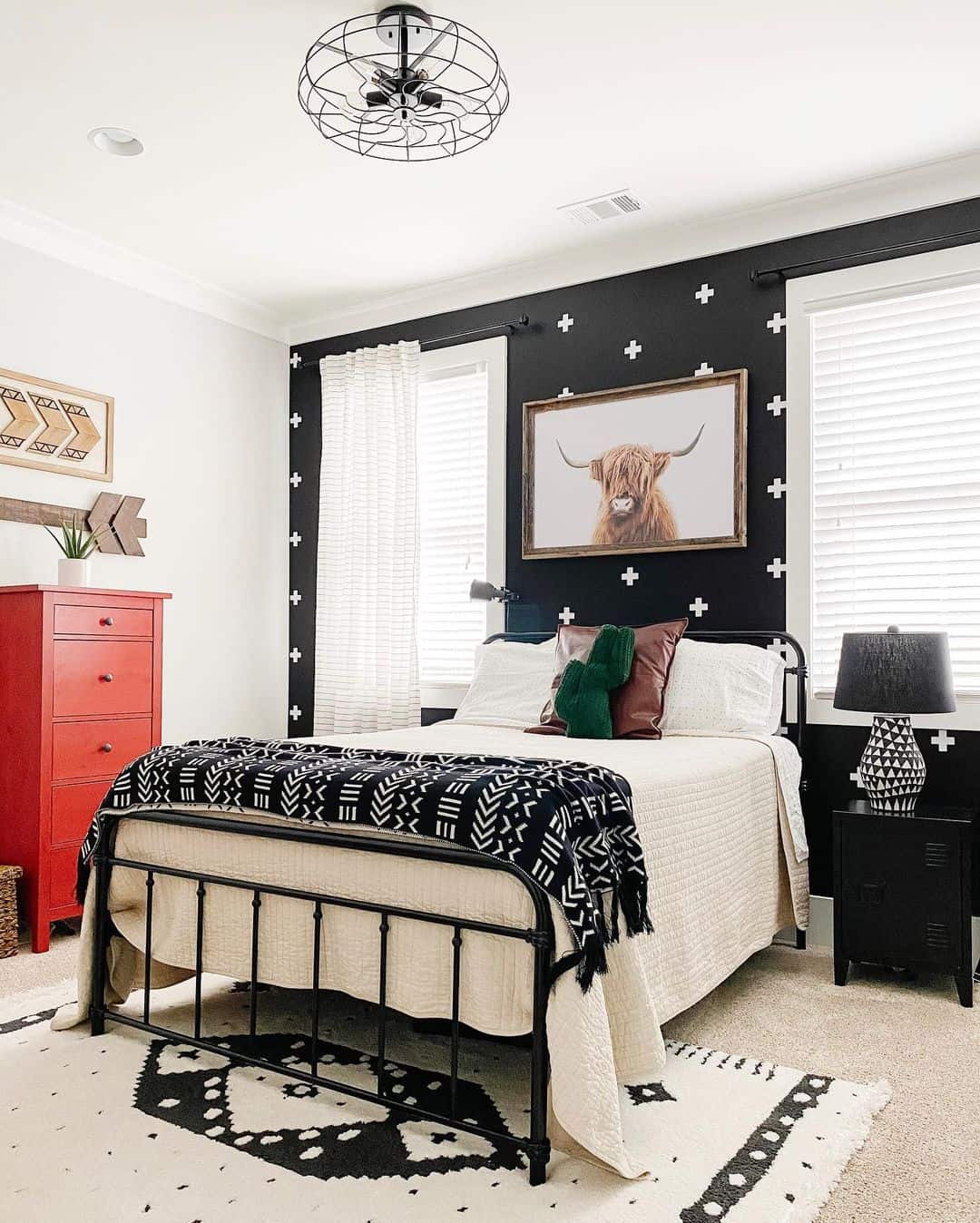 Black Accent Wall with White Crosses for Graphic Appeal