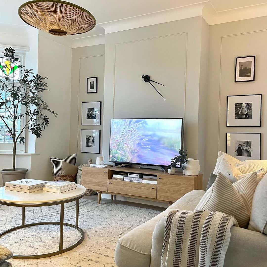 Minimalist Black Clock Adds Graphic Contrast Above TV