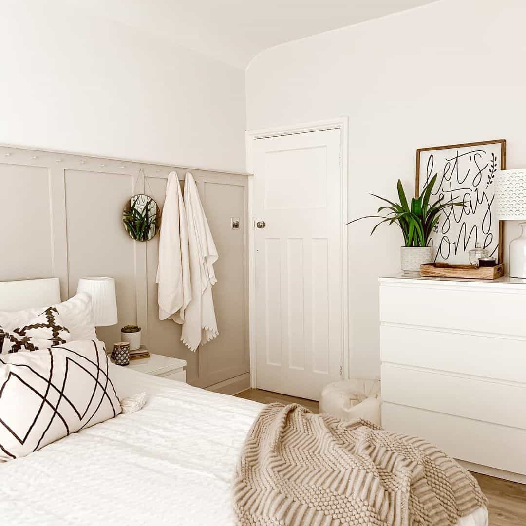 Utilize a Paneled Wall With Hooks for Towels and Decor