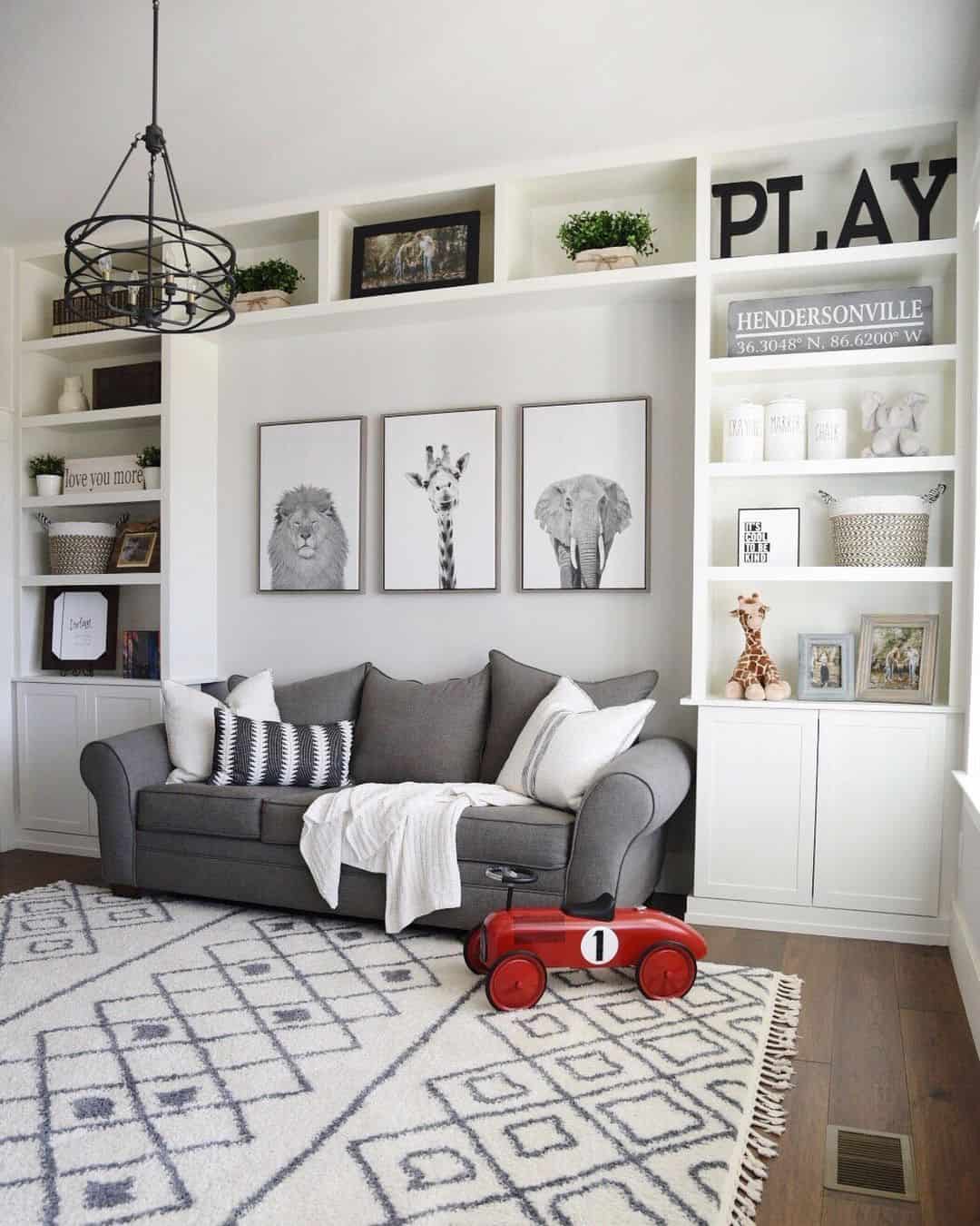Large 'PLAY' Letters Anchor the Built-In Shelving