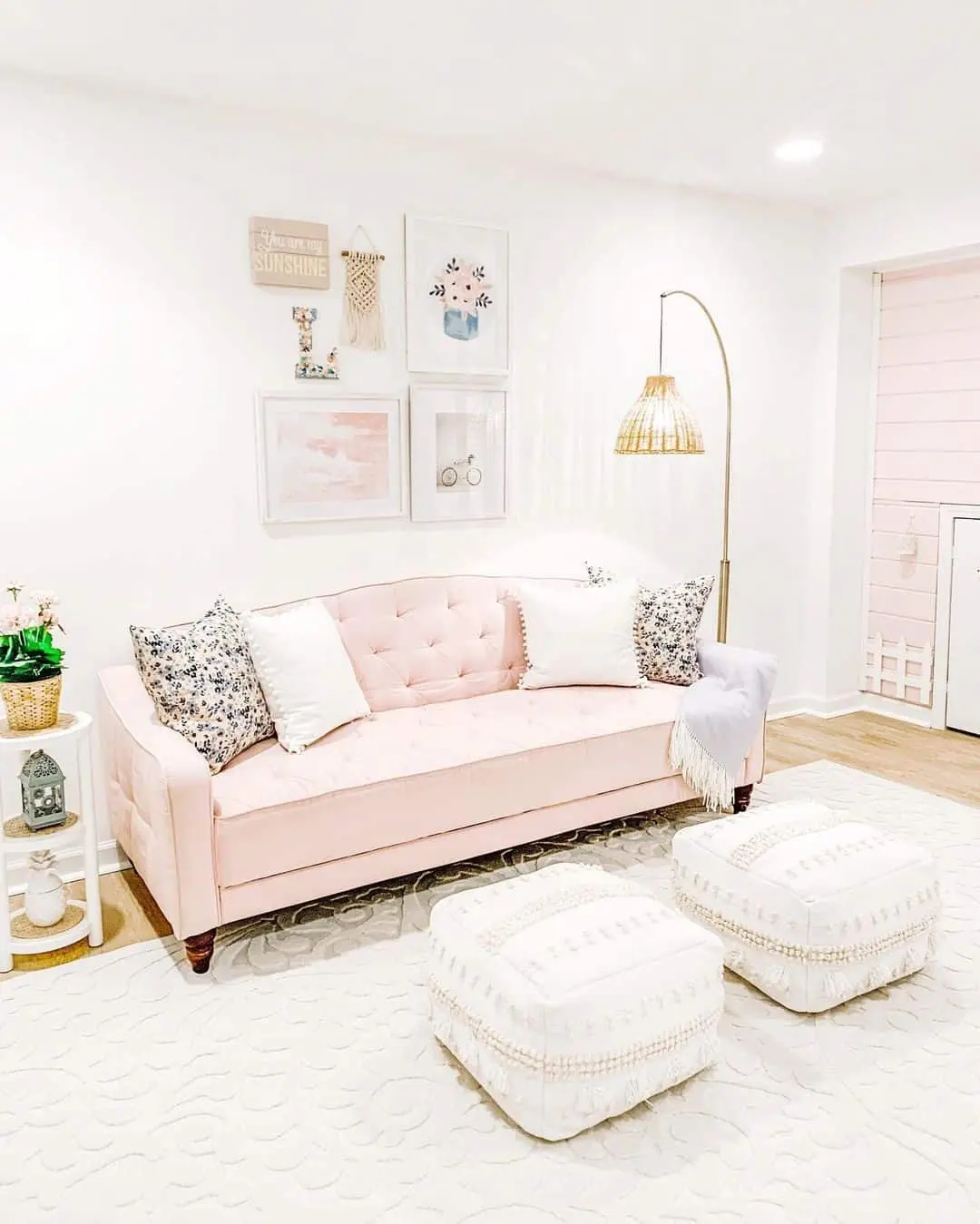 Gallery Wall Above Pink Tufted Sofa Adds Whimsy