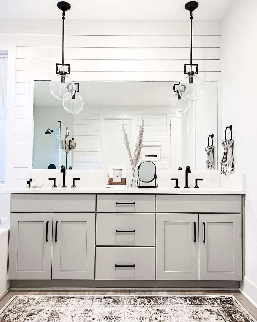 Frame Your Mirror with Geometric Cage Pendant Lights