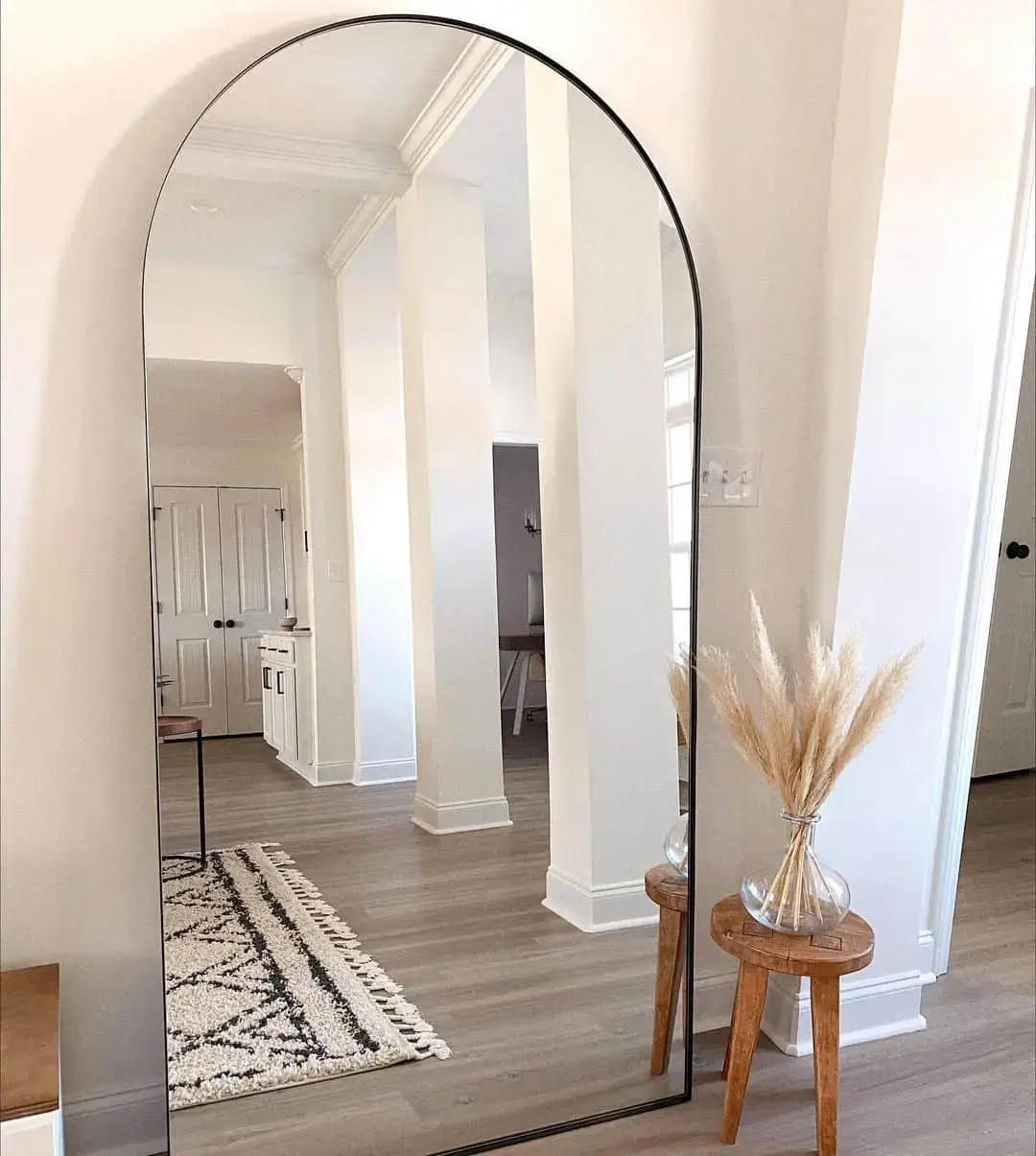 Widen Your Entryway with an Arched Mirror and Pampas Grass