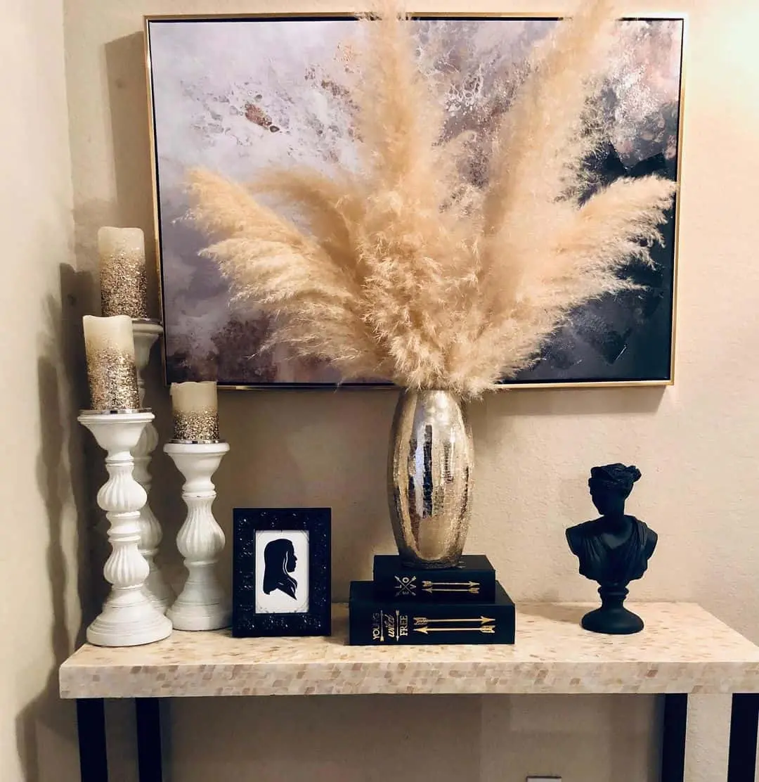 Stacked Black Books Add Height and Contrast to Vase Display