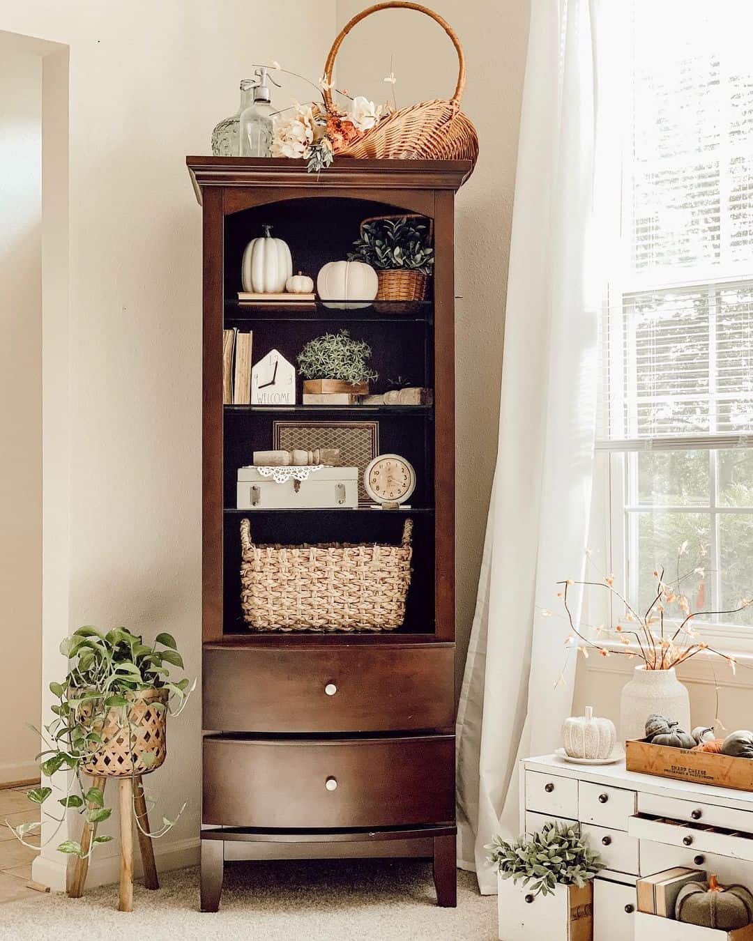 Dark Wood Bookcase Displays Seasonal Accents