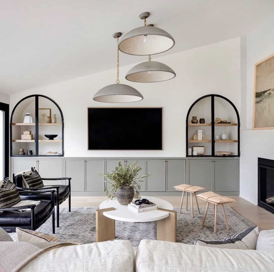 Arched Built-In Cabinets Flank Open Shelving Units