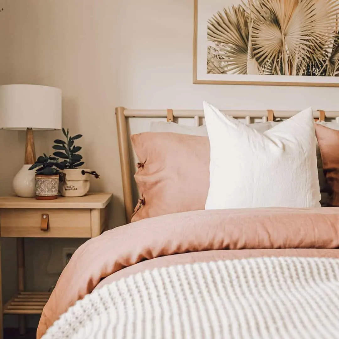 Framed Palm Frond Art Adds Tropical Calm Above Bed