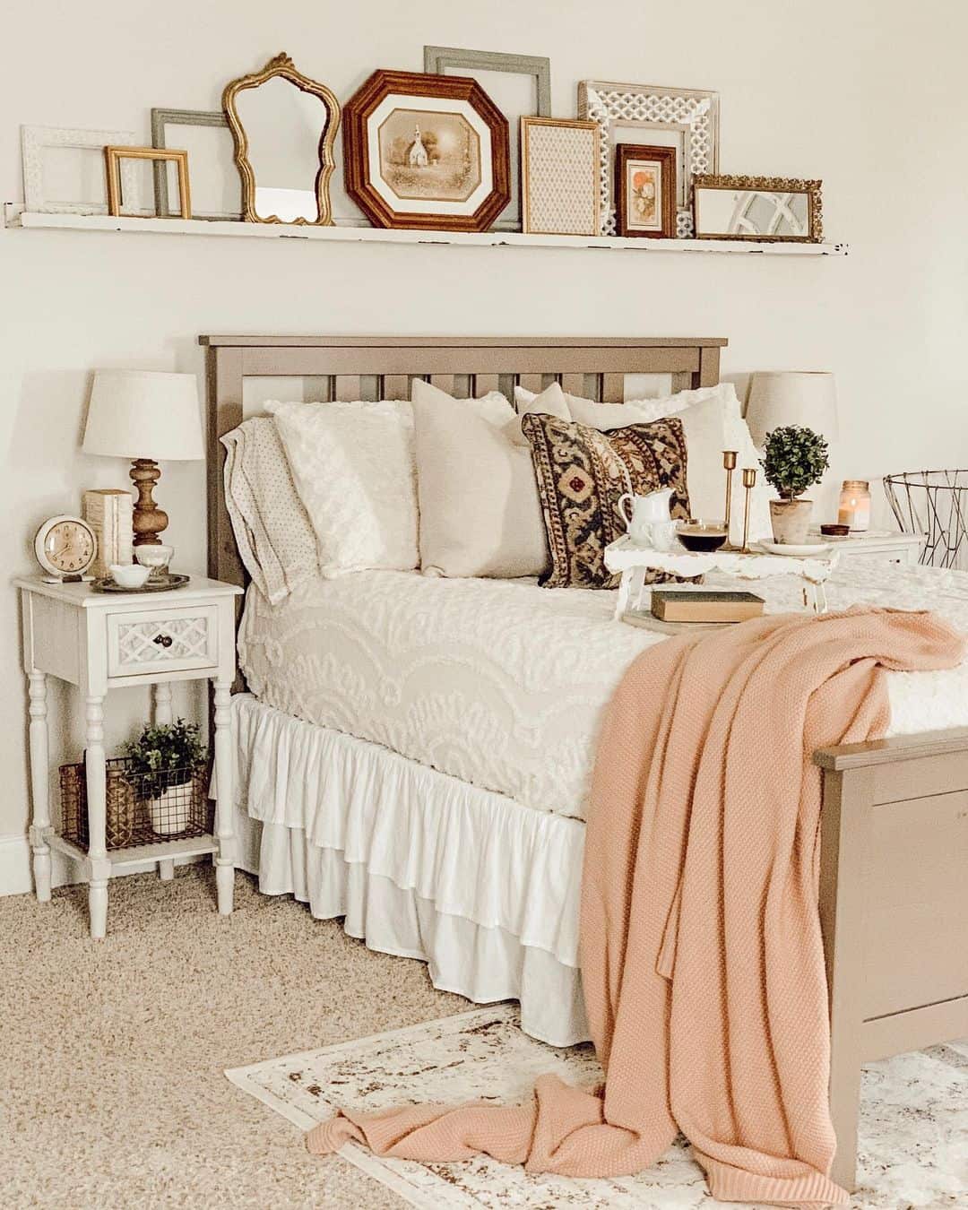 Layered Frames Create An Eclectic Gallery Above The Bed