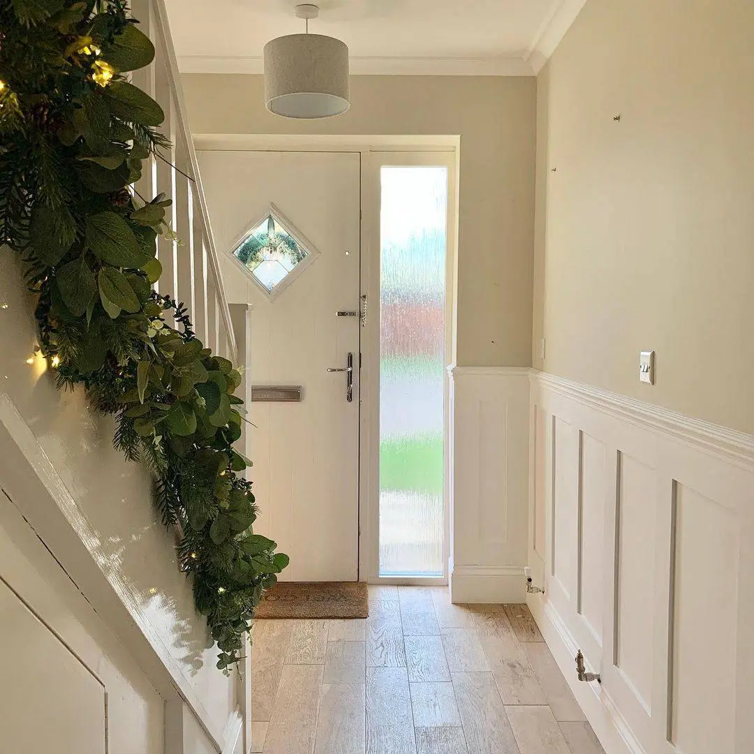 White Wainscoting Panels Add Classic Charm to Hallways