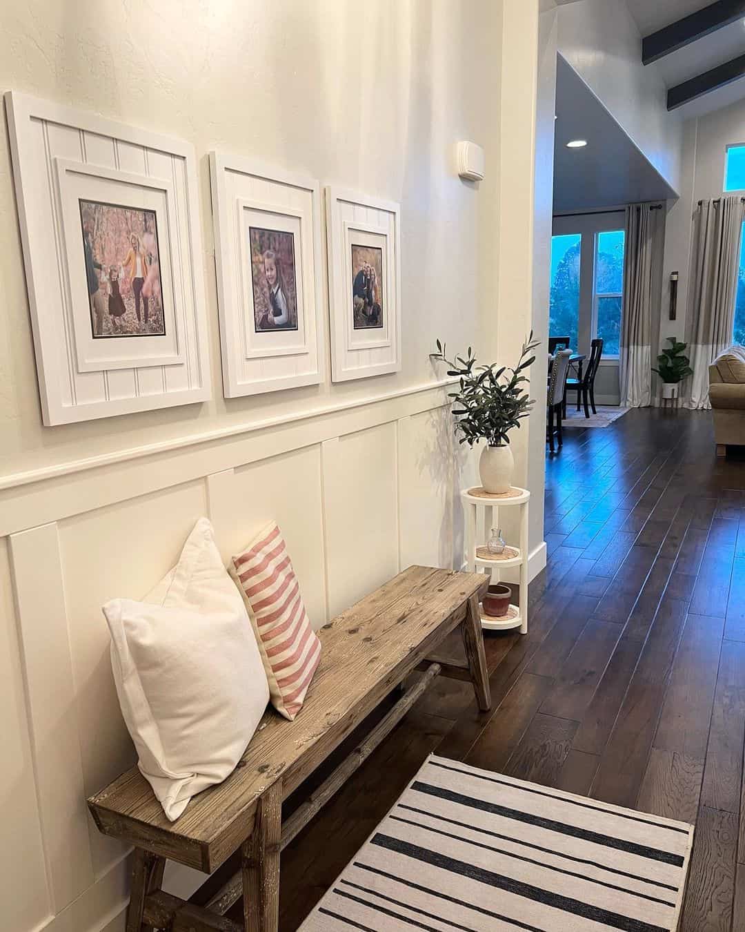 White Wainscoting Frames a Trio of Family Photos