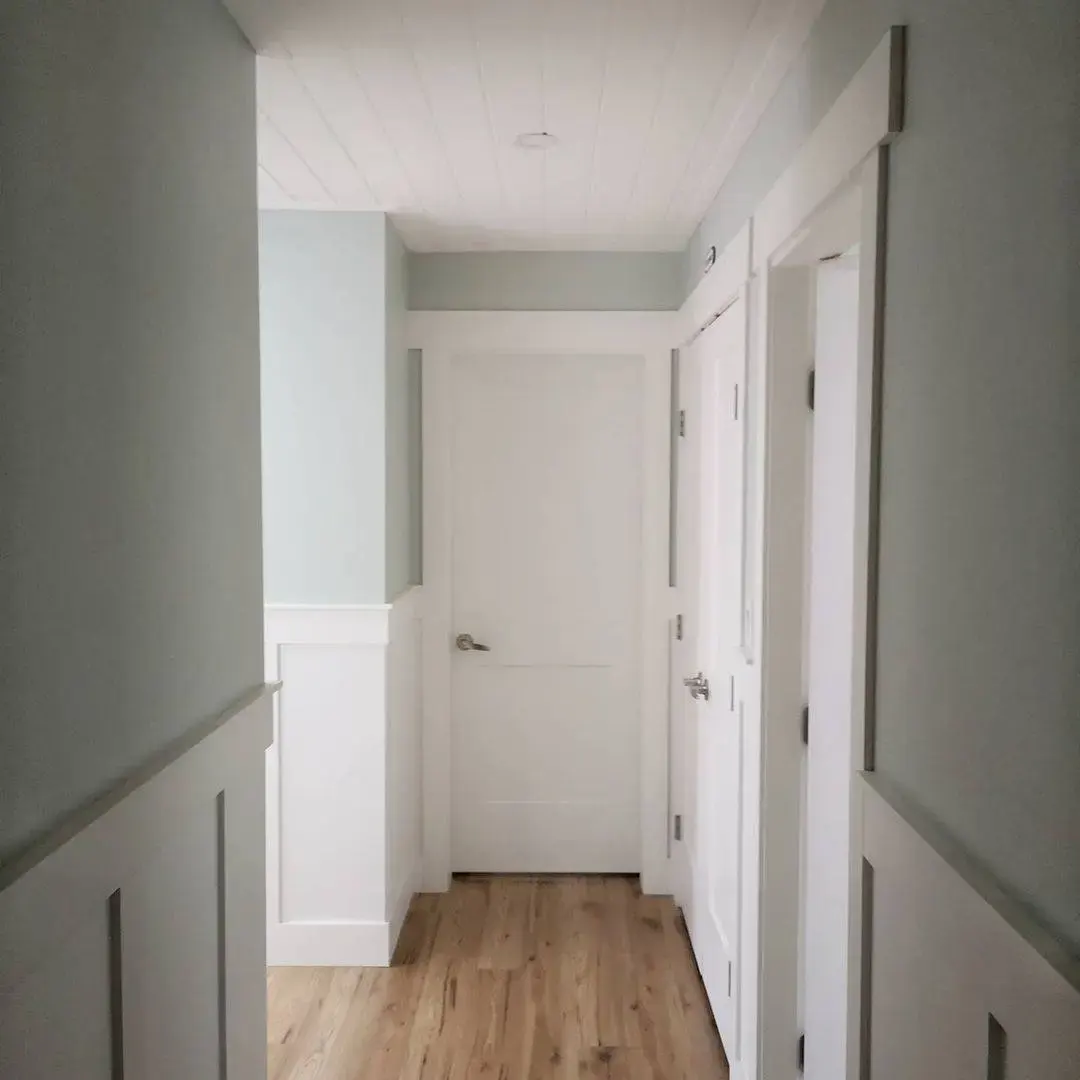 White Wainscoting With Recessed Panels Adds Architectural Interest