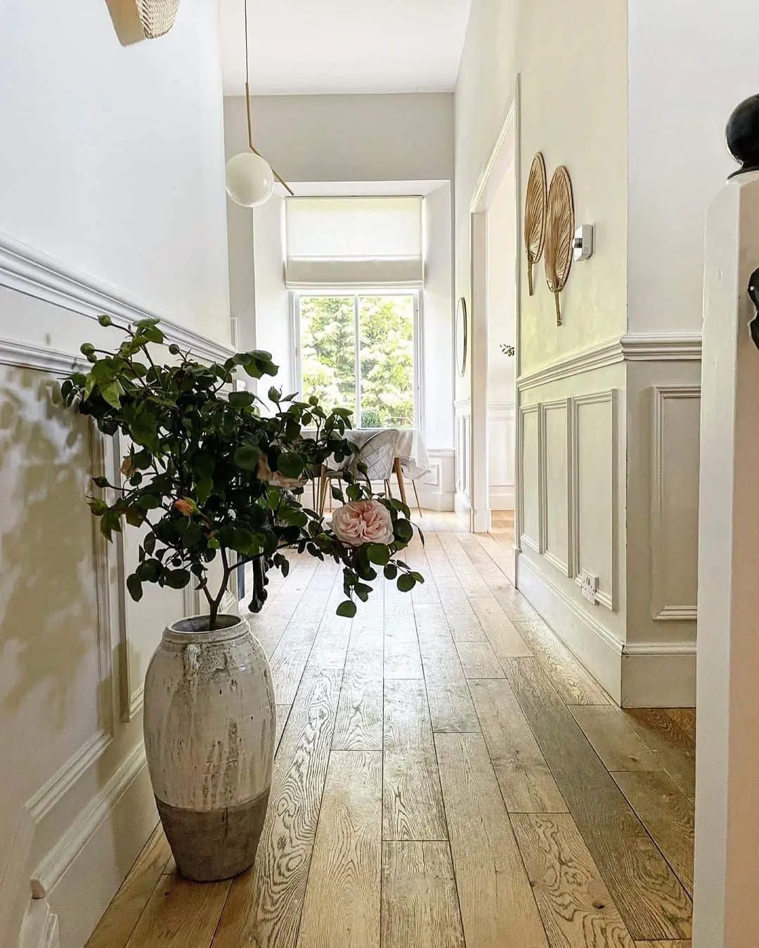 Tall Textured Vase Brings Organic Life to Hallway Wainscoting