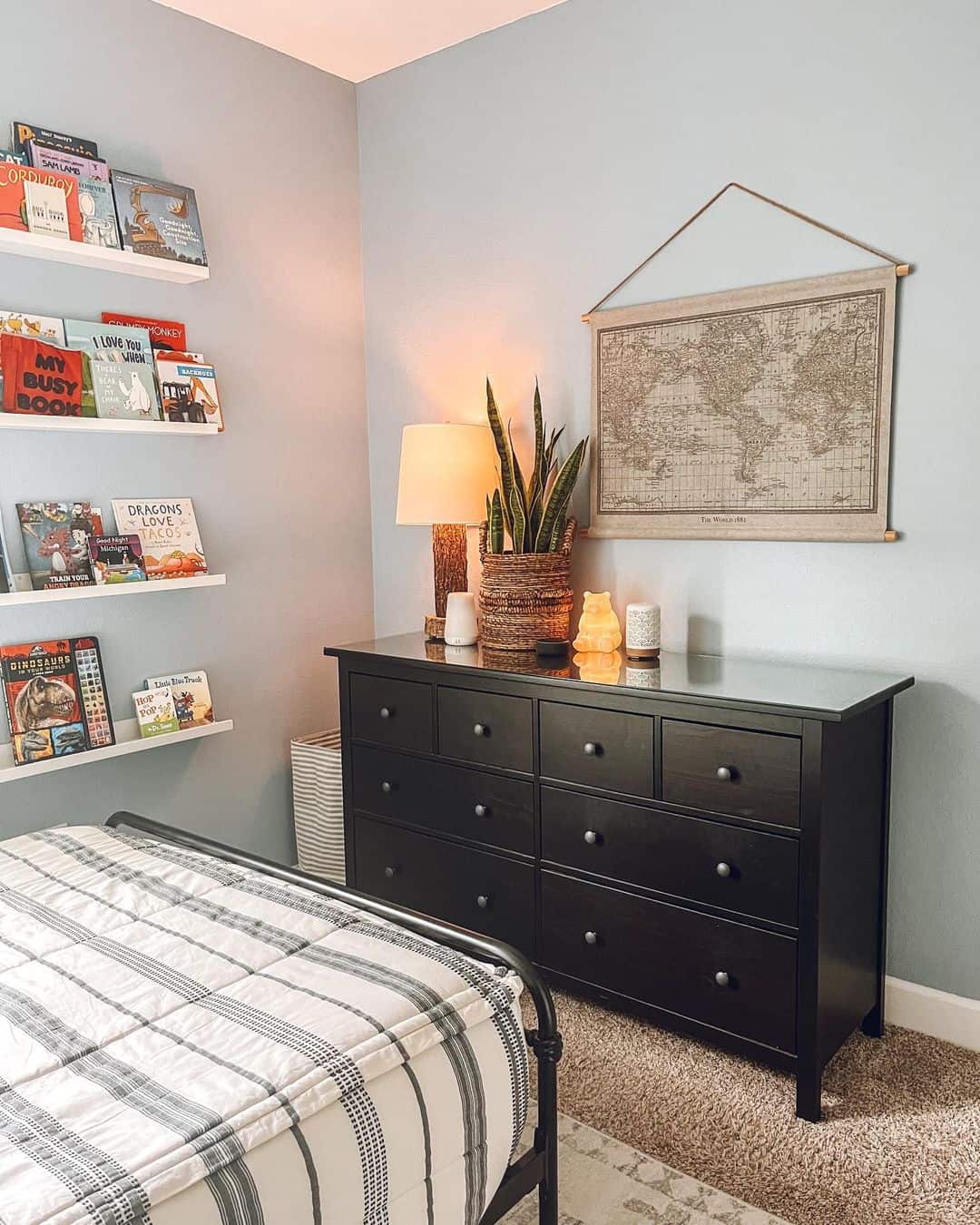 Fabric World Map Hung With a Leather Cord for a Travel-Inspired Accent