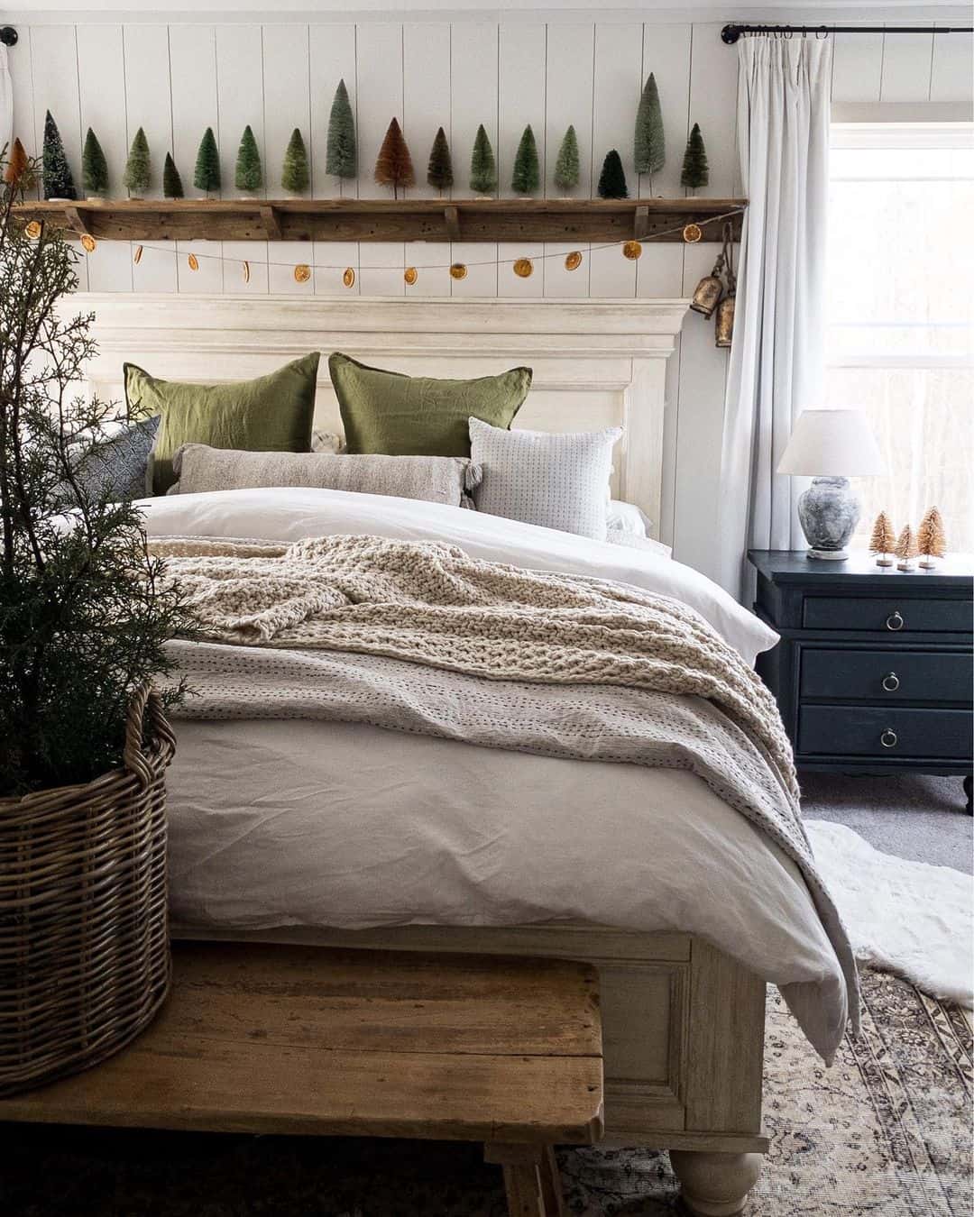 Layer Rustic Shelves with Festive Mini Trees and Orange Garland