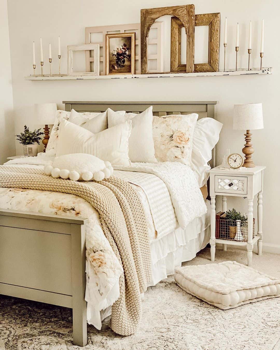 Layered Vintage Frames Create a Gallery Above the Bed