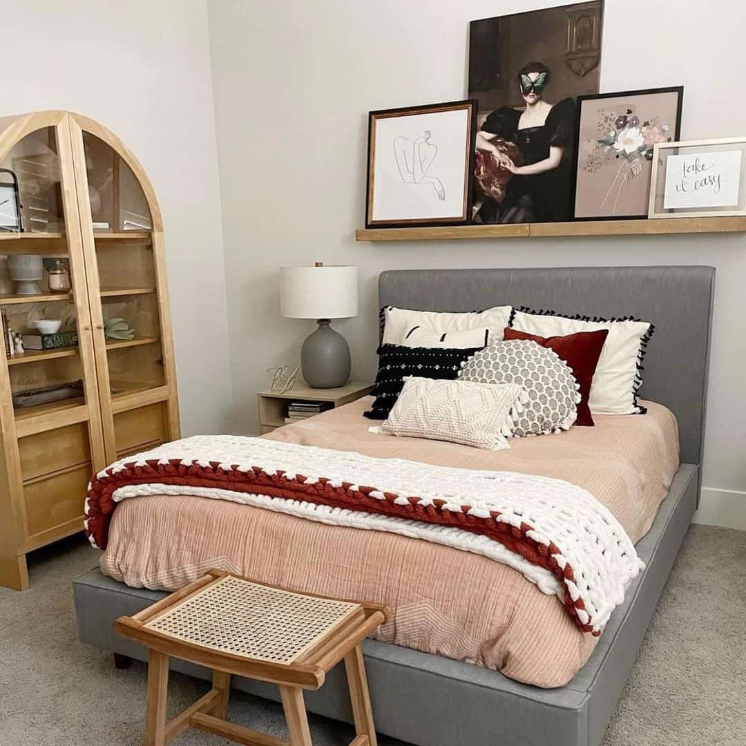 Layer Artwork on a Narrow Shelf Above Your Bed