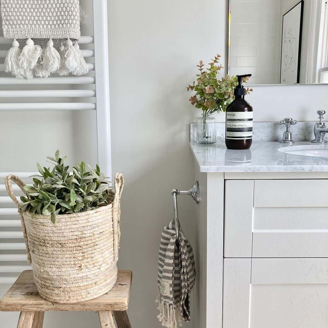 Woven Rope Basket Holds Greenery on a Rustic Stool