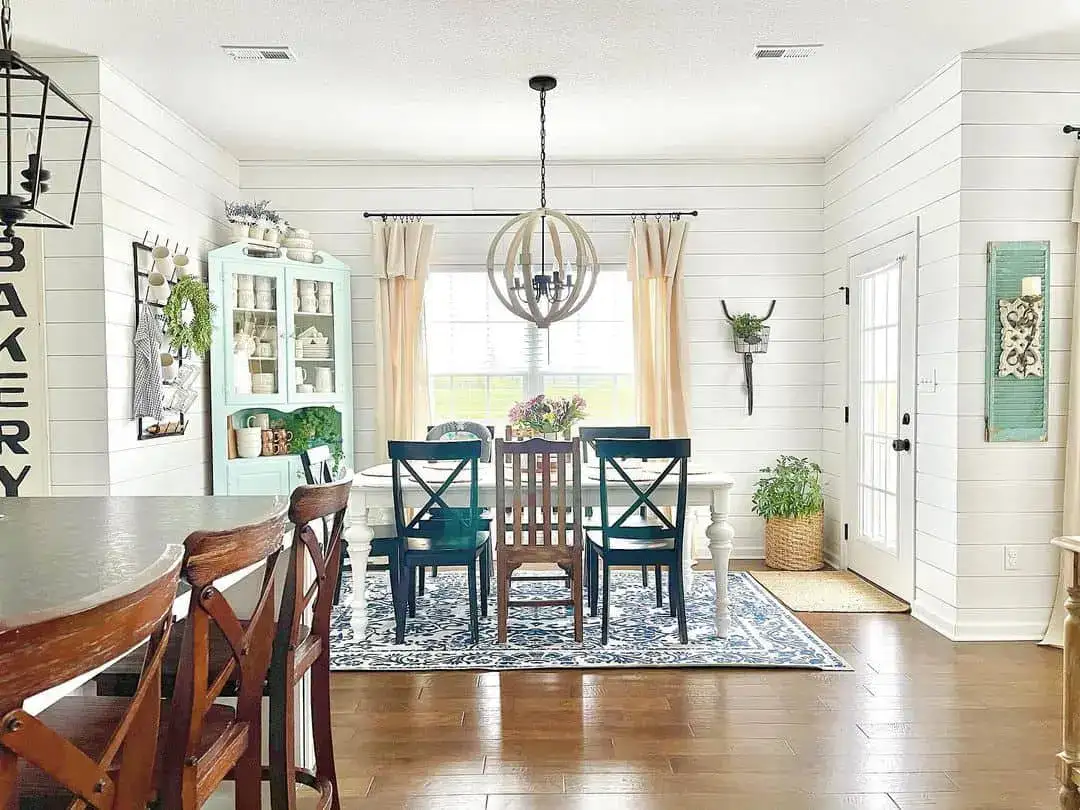 Blue and White Patterned Rug Anchors Dining Space