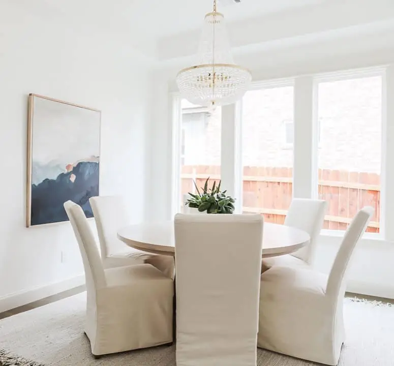 Abstract Landscape Art Adds Color Above Chairs