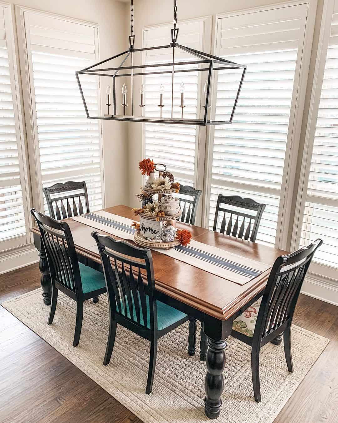 Textured Rug Anchors Wood Table with Black Chairs