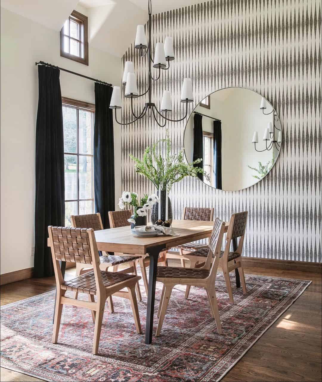 Round Mirror Reflects Patterned Wallpaper