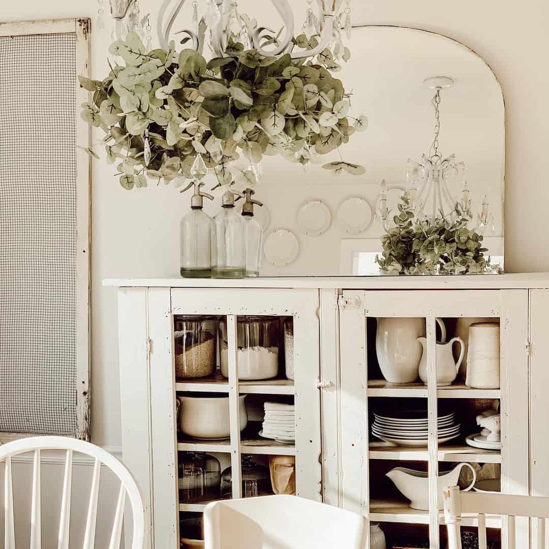 Arched Mirror Frames a Lush Greenery Display