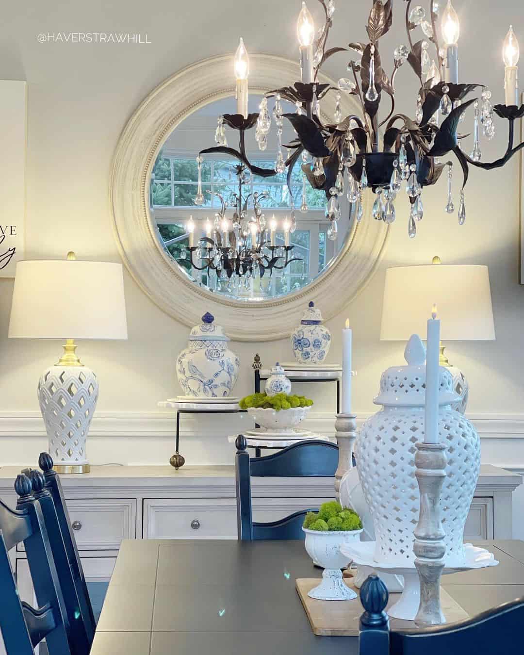 Textured White Mirror Frames a Chandelier