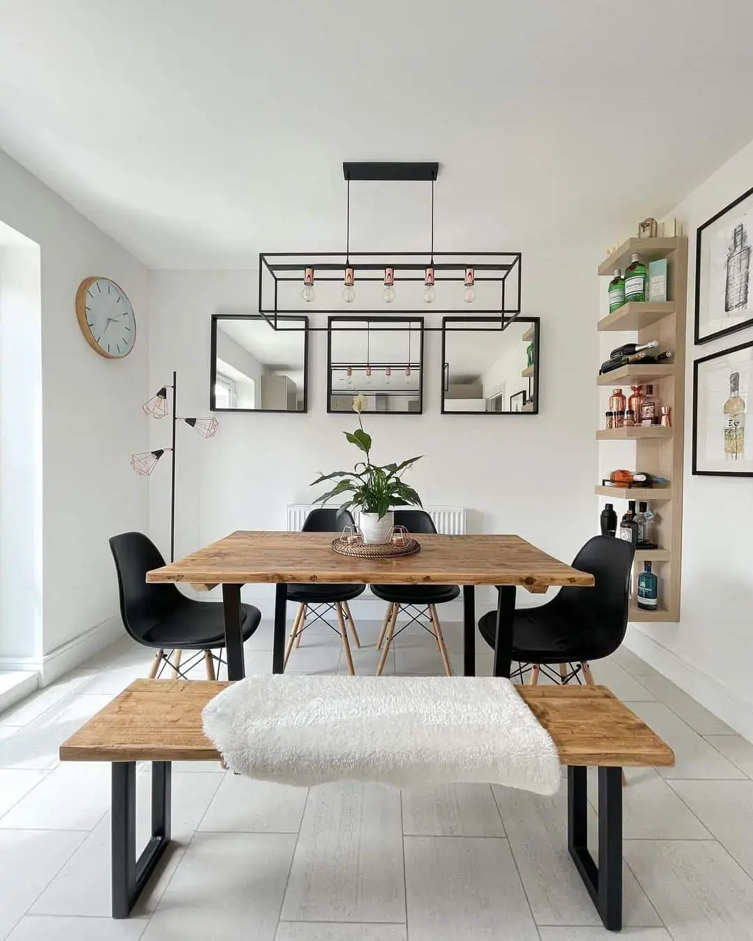 Three Square Mirrors Create a Grid Above the Dining Table