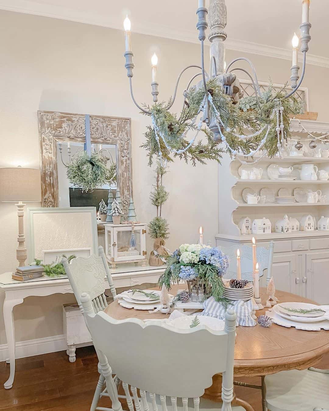 Ornate Distressed Mirror Frames a Frosted Wreath