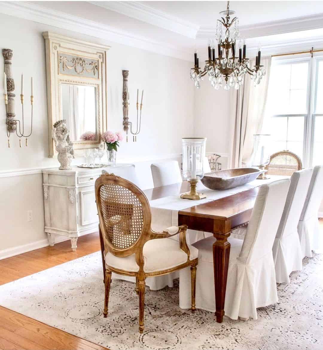 Ornate Mirror with Carved Details Frames a Buffet Display