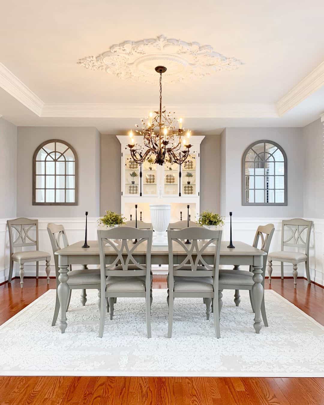 Arched Pane Mirrors Frame the Dining Room Walls