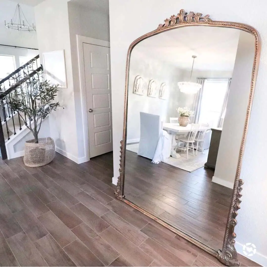 Lean a Tall, Ornate Mirror for a Grand Entrance