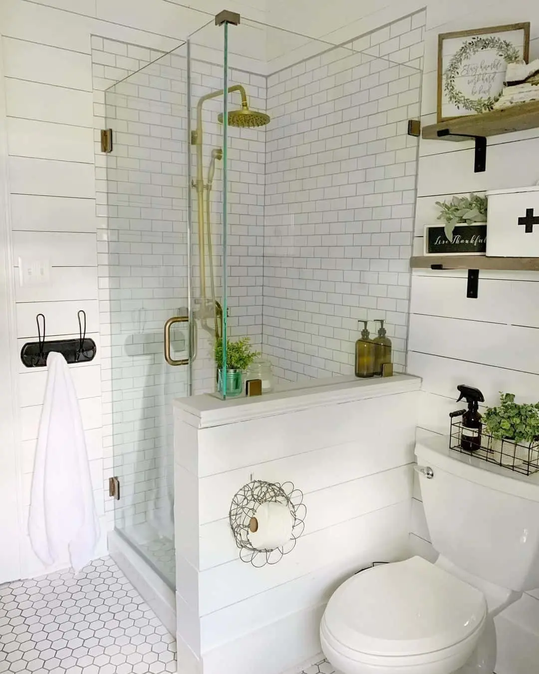 Glass Shower Enclosure With Gold Fixtures Creates a Luxe Spa Feel