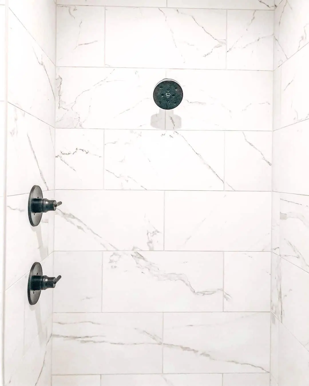 Marble-Look Tiles Create a Serene Shower Backdrop