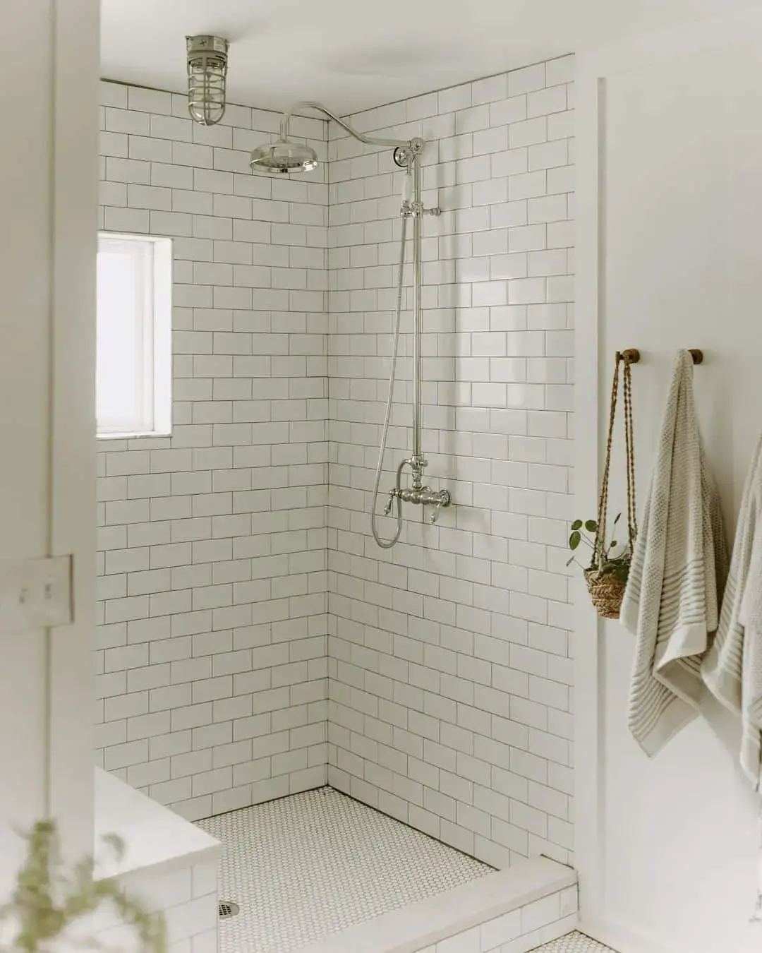 Industrial Cage Light Fixture Adds Character to a Steamy Shower